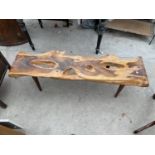 A YEW WOOD COFFEE TABLE ON TAPERED LEGS BY REYNOLDS OF LUDLOW, 48x13"