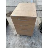 A WOODEN THREE DRAWER FILLING CABINET