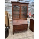 AN EDWARDIAN MAHOGANY AND INLAID GLAZED AND LEADED BUREAU BOOKCASE, 48" WIDE