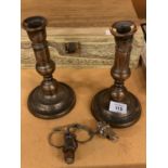 A PAIR OF VINTAGE SILVER PLATED ON COPPER CANDLESTICKS - HEIGHT 21CMS AND TWO WHITE METAL BOTTLE