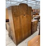 A SHINY WALNUT WARDROBE AND OAK FOUR DRAWER CHEST WITH MIRRORED BACK