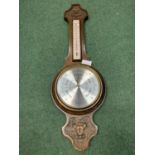 A CARVED OAK BAROMETER BY COMITTI OF LONDON