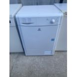 A WHITE INDESIT TUMBLE DRYER BELIEVED IN WORKING ORDER BUT NO WARRANTY