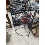 A DECORATIVE WROUGHT IRON PLANT STAND