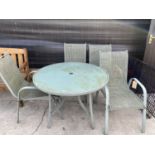 A METAL GARDEN TABLE WITH GLASS TOP ALONG WITH FOUR MATCHING GARDEN CHAIRS