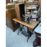 A SINGER TREADLE SEWING MACHINE