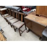 A MID 20TH CENTURY OAK DROP LEAF DINING TABLE AND FOUR CHAIRS