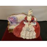 A ROYAL DOULTON FIGURINE BELLE OF THE BALL HN 1997 (A/F CHIP TO BACK OF SETTEE SEE PHOTO)