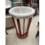 A STAINED BEECH LAUNDRY BAG STAND