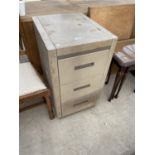 A METAL THREE DRAWER FILING CABINET