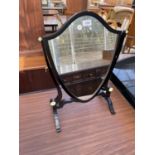 A 19TH CENTURY STYLE EBONISED SWING FRAME MIRROR