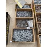 FOUR WOODEN STORAGE BOXES CONTAINING A LARGE QUANTITY OF NAILS TO INCLUDE FELTING NAILS