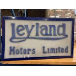 AN ILLUMINATED 'LEYLAND MOTORS LIMITED' SIGN