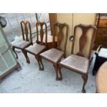 A SET OF FOUR QUEEN ANNE STYLE DINING CHAIRS