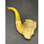 A BONE AND AMBER CARVED PIPE DEPICTING A BEARDED GENTLEMAN WEARING A TURBAN