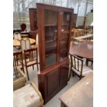 A RETRO DANISH DESIGN CORNER CUPBOARD WITH GLAZED UPPER PORTION