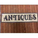 AN ILLUMINATED 'ANTIQUES' SIGN