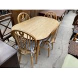 A KITCHEN TABLE AND FOUR WHEELBACK WINDSOR STYLE CHAIRS