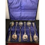 A BOXED SET OF WALKER AND HALL SILVER PLATED SOUP SPOONS