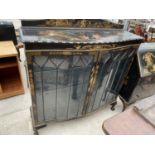 AN EARLY 20TH CENTURY CHINOISERIE TWO DOOR DISPLAY CABINET ON BALL AND CLAW FEET, 48" WIDE