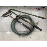 A MANUAL WATER PUMP AND A PAIR OF GRASS SHEARS