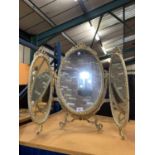 A CREAM AND GILT TRIPLE DRESSING TABLE MIRROR