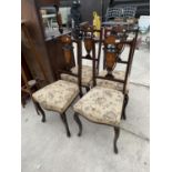 FOUR EDWARDIAN EBONISED AND PROFUSELY INLAID PARLOUR CHAIRS