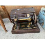 A VINTAGE SINGER SEWING MACHINE COMPLETE WITH CARRY CASE