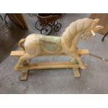 A VINTAGE WOODEN CARVED ROCKING HORSE - HEIGHT TO SADDLE 65CMS