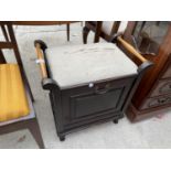 AN EDWARDIAN MAHOGANY EBONISED PIANO STOOL WITH DROP DOWN SHEET MUSIC SECTION