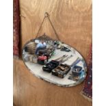 A DECORATIVE BEVEL EDGE ART DECO MIRROR WITH METAL CLIP AND CHAIN