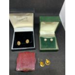 THREE PAIRS OF 9 CARAT GOLD EARRINGS TO INCLUDE PEARL AND YELLOW STONE GROSS WEIGHT 4.7 GRAMS