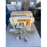 A RETRO FRISTER AND ROSSMANN SEWING MACHINE WITH CASE