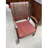 A MID 20TH CENTURY FIRESIDE CHAIR