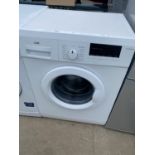 A WHITE LOGIK WASHING MACHINE BELIEVED IN WORKING ORDER BUT NO WARRANTY