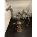 A LARGE CAST METAL CAMEL AND A MIDDLE EASTERN STYLE COFFEE POT