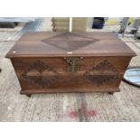 AN ASIAN CAMPHOR WOOD CHEST WITH CARVED PANELS