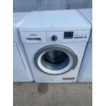 A WHITE SIEMENS WASHING MACHINE BELIEVED IN WORKING ORDER BUT NO WARRANTY