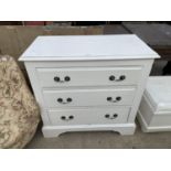 A WHITE PAINTED THREE DRAWER CHEST SUPPLIED BY ASTON & SONS