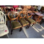 A SET OF SIX VICTORIAN MAHOGANY BALLOON BACK DINING CHAIRS