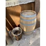 A WOODEN WHISKEY BARREL AND A FURTHER WOODEN CLADDED ICE BUCKET