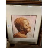 A WOODEN FRAMED PORTRAIT PRINT OF AN AFRICAN TRIBESMAN