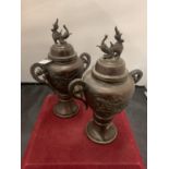 A PAIR OF EARLY BRONZE LIDDED JARS HEIGHT: 26CM