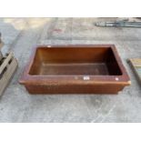 A GLAZED BROWN TROUGH