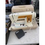 A RETRO FRISTER AND ROSSMANN SEWING MACHINE WITH CASE