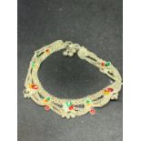 A WHITE METAL POSSIBLY SILVER ORNATE BRACELET