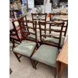 FOUR CARVED OAK DINING CHAIRS