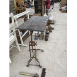 A VINTAGE WOODEN TOPPED AND METAL BASE BED TABLE