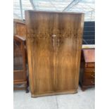 A 'WARING & GILLOW' TWO DOOR WALNUT WARDROBE