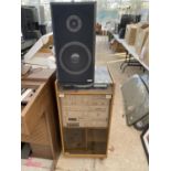 AN AMSTRAD RECORD PLAYER AND STEREO SYSTM IN WOODEN DISPLAY CABINET WITH A PAIR OF AMSTRAD SPEAKERS